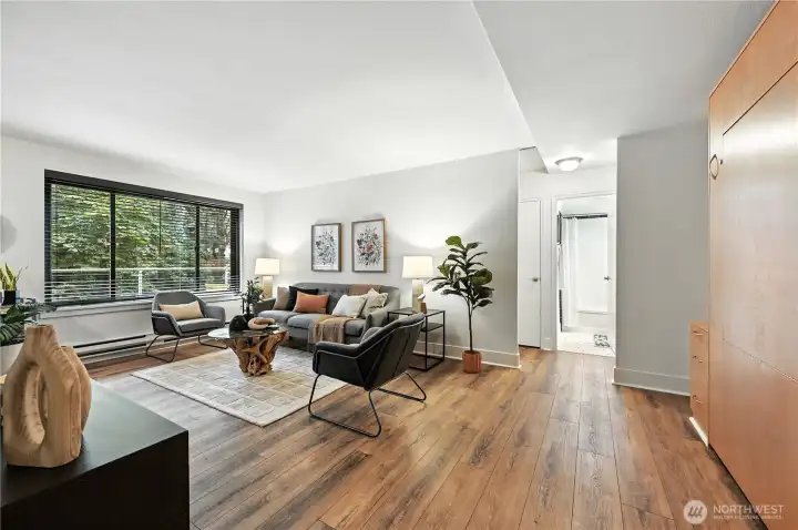 Here you can see how open & spacious the living area is with the picturesque treed outlook.