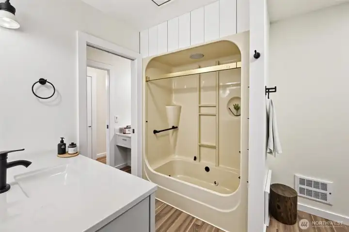 Large full bath with room on the right side of this photo for laundry machines!