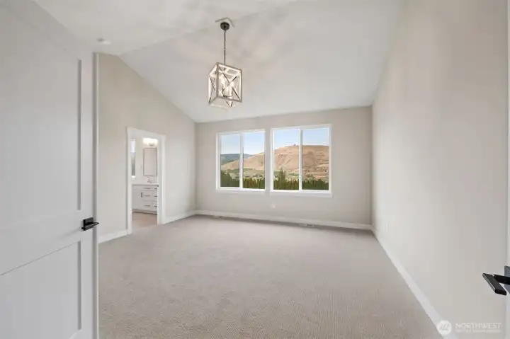 Enter double doors to the primary suite