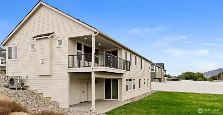 Viewing deck above, lower patio and HUGE storage room with power below.