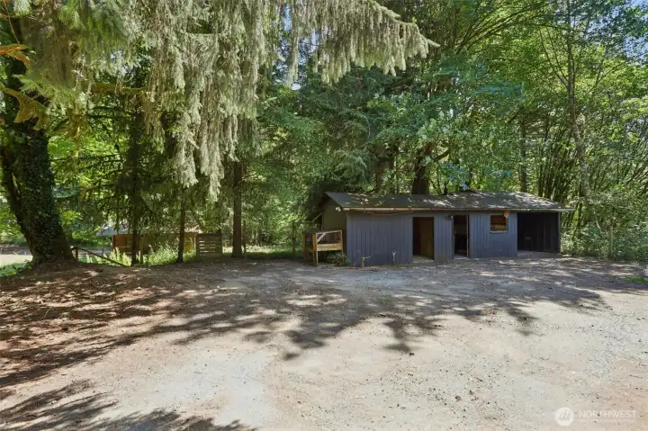 Outdoor shops next to the garage- to the left of this building, look closely to the woods on the left, notice the horse stalls in proximity....the gate to the left will take you to the horse stalls. Such a beautiful property to admire.