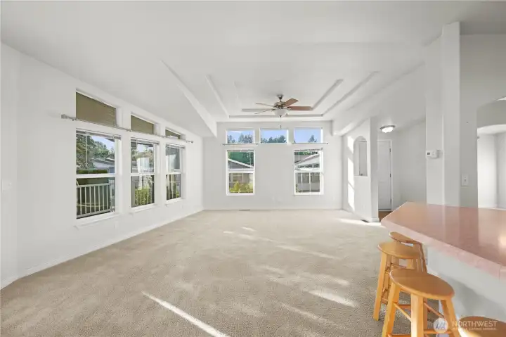 The open great room design blends the living and dining spaces, offering a bright and inviting layout perfect for gathering.