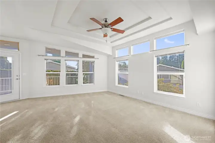 Enjoy an airy, open feel with large windows that fill the home with natural light and offer serene views of the blue sky.