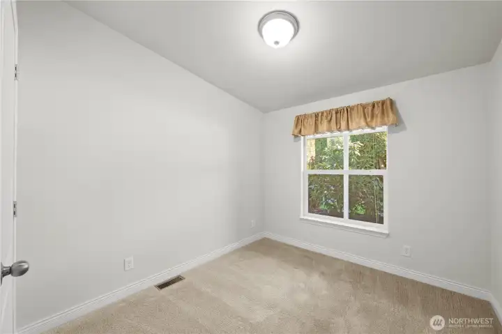 Have friends or family visiting? This inviting guest bedroom provides a comfortable space for them to stay.