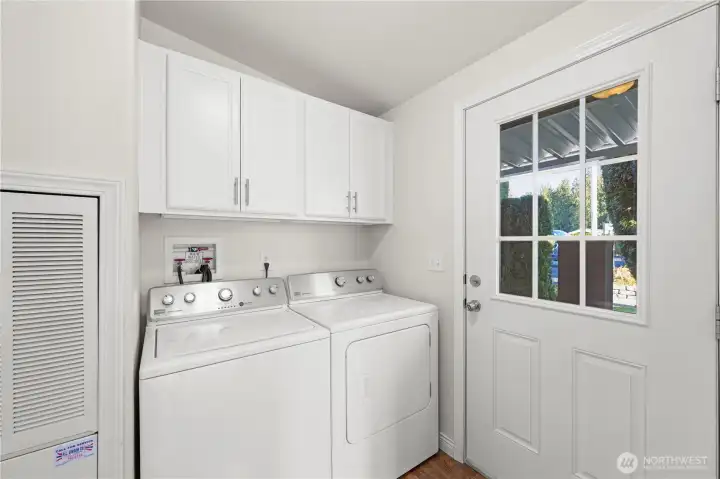 Laundry is a breeze with a washer and dryer provided, plus overhead storage for supplies.