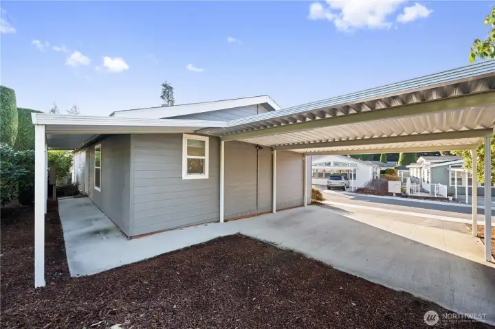 Enjoy the ease of a covered pathway connecting the carport to the back door, perfect for comfort and convenience rain or shine.