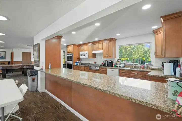 A large, beautiful kitchen in the clubhouse is designed for cooking, entertaining, and hosting friends or family gatherings with ease.