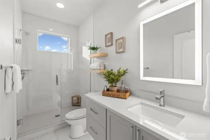 Main bathroom with custom tile and undermount lighting