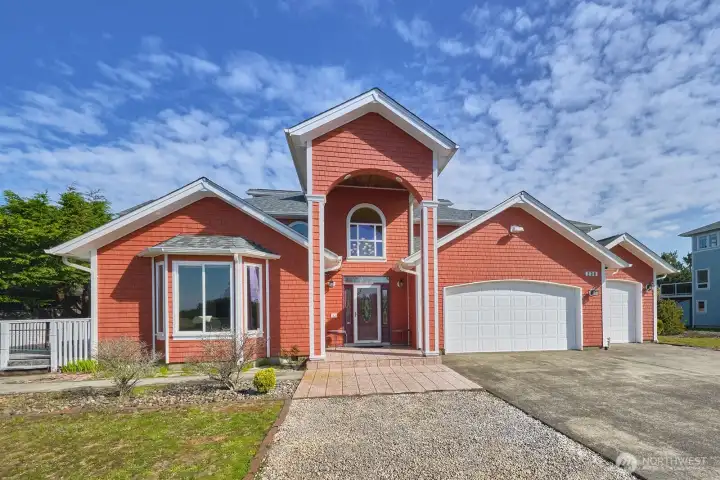 Welcoming covered entry with charming architectural accents.