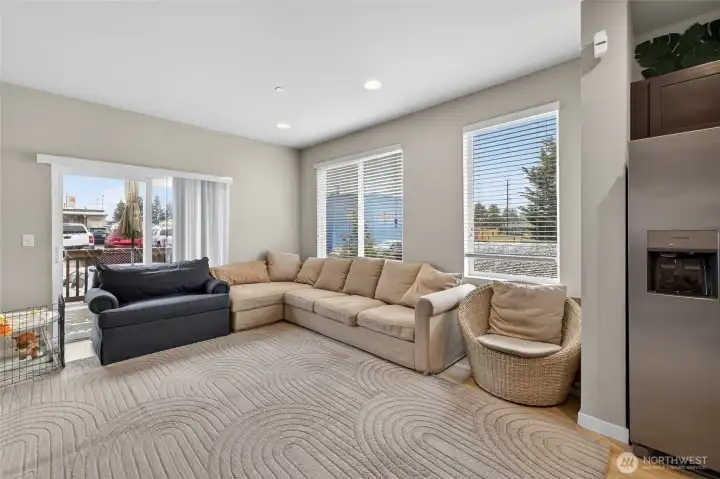Light-filled secondary living area with large windows and versatile open layout