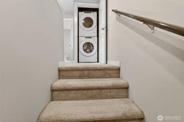 Upper-level staircase landing with built-in storage and efficient use of space