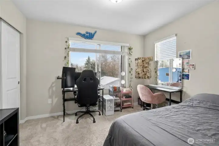 Spacious 3rd floor bedroom with versatile layout, ideal as a home office or guest room