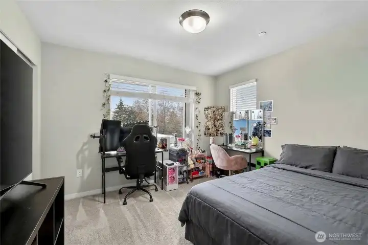 Well-appointed 3rd floor bedroom with ample closet space and bright, airy natural light