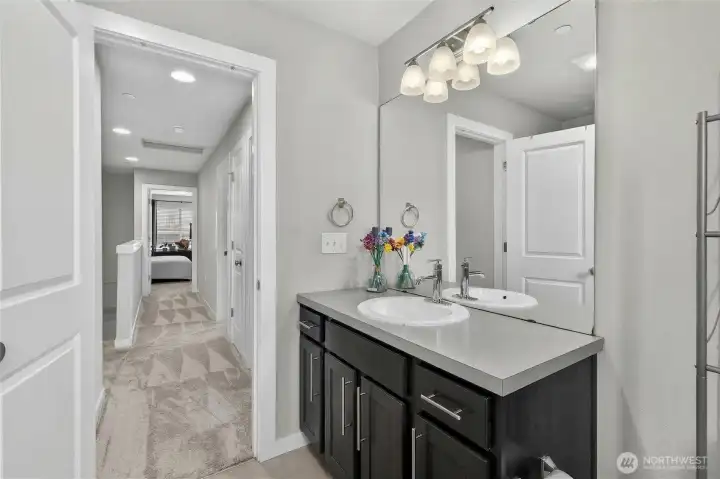 3rd floor hallway full bathroom featuring clean tilework, updated fixtures, and generous counter space