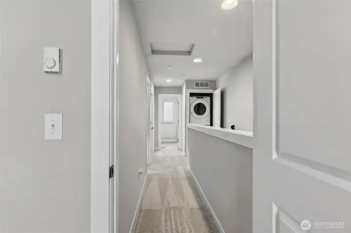 3rd floor master bedroom hallway corridor with clean sightlines leading to all bedrooms and bathrooms