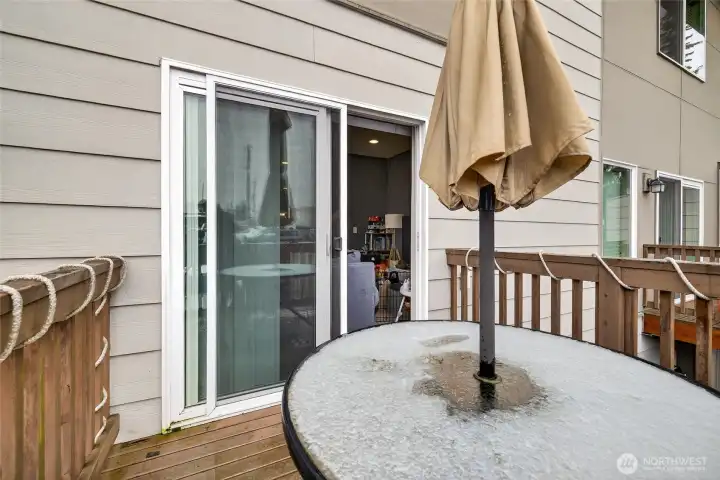 Inviting private deck with outdoor dining area, perfect for entertaining and relaxing