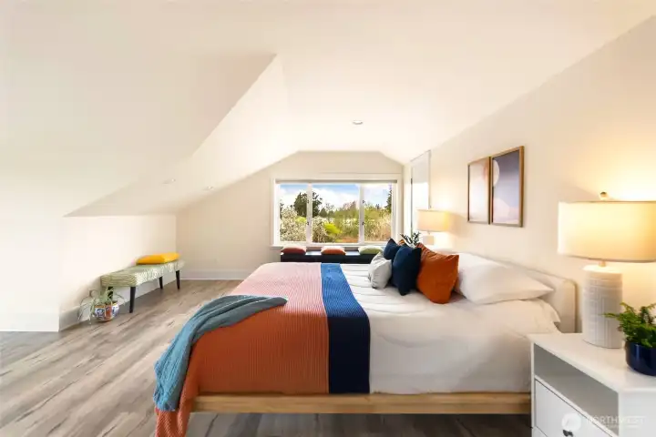 Primary suite offers a massive walk-in closet and ensuite bath