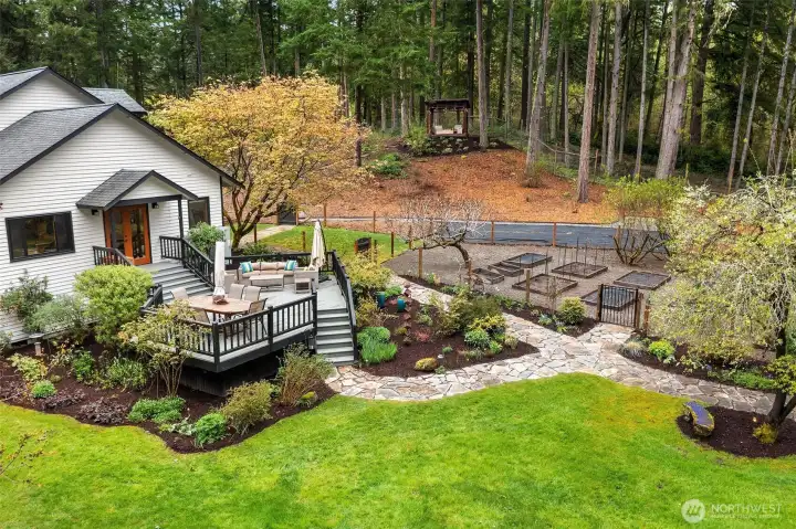 Gracious decks for dining al fresco.Deer fenced kitchen garden.