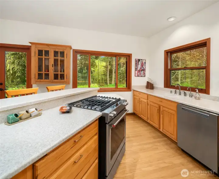 The kitchen has a functional layout and updated quality appliances.