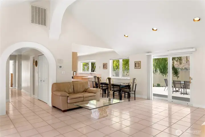 Large living area looking back down hall and out towards waterfront