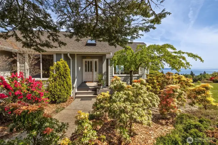 Mature colorful shrubs are glorious. The entry features stunning colorful gardens!