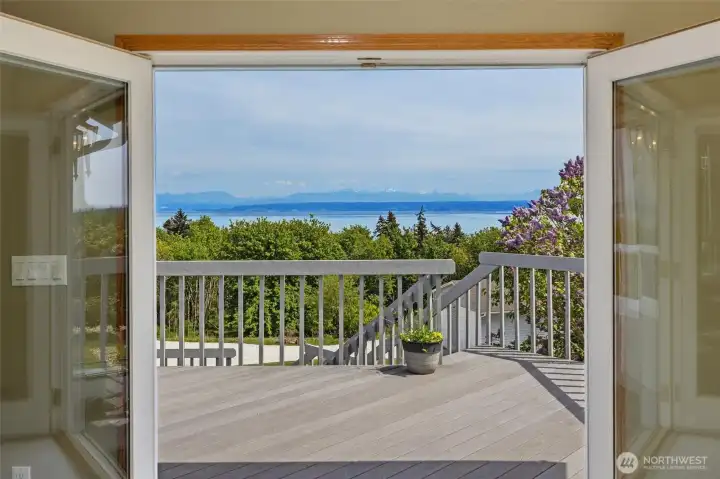 French doors open up to the many tiered deck and the VIEW!!