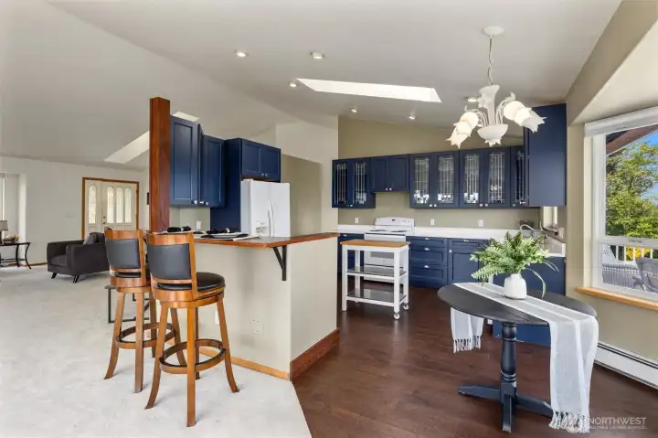 Have your favorite beverage at the bar while someone puts together a culinary masterpiece in this beautiful kitchen!