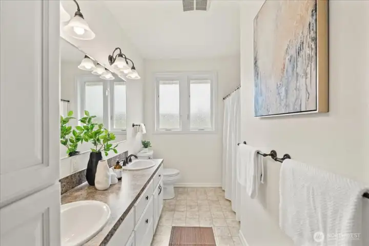 Full bathroom with dual sinks