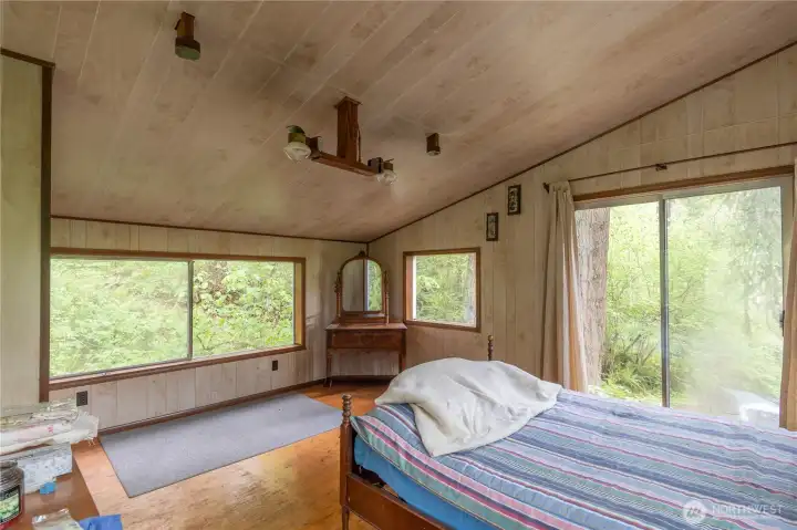 Another view of the bedroom with propane lights.