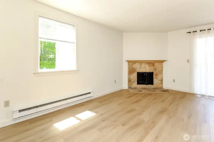 Light and bright living room w/wood burning fireplace Light and bright living room w/wood burning fireplace