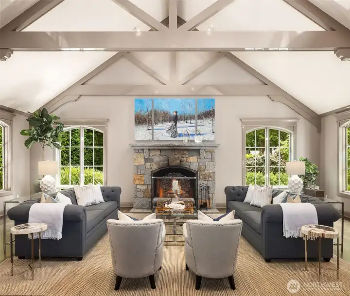 The living room’s expansive layout easily accommodates a generous, symmetrical seating arrangement. Positioned around the grand stone fireplace, it serves as the perfect central hub for stylish entertaining or comfortable relaxation. The living room’s expansive layout easily accommodates a generous, symmetrical seating arrangement. Positioned around the grand stone fireplace, it serves as the perfect central hub for stylish entertaining or comfortable relaxation.
