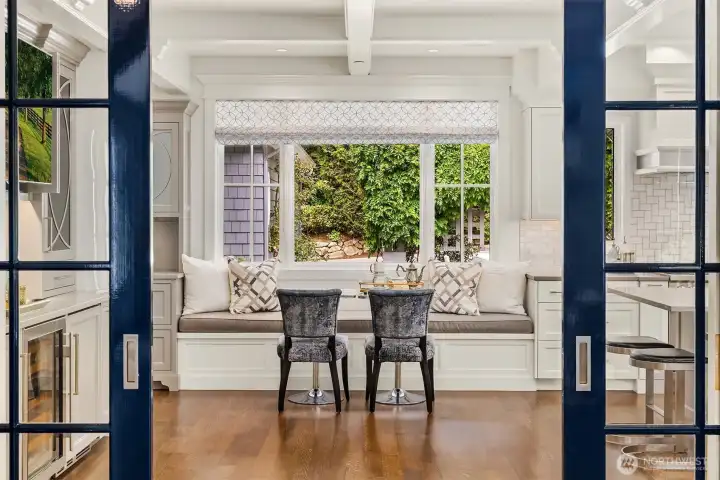 Sophisticated multi-pane glass doors provide a stylish option to separate the kitchen from the main living and dining areas without sacrificing natural light or sightlines. Sophisticated multi-pane glass doors provide a stylish option to separate the kitchen from the main living and dining areas without sacrificing natural light or sightlines.