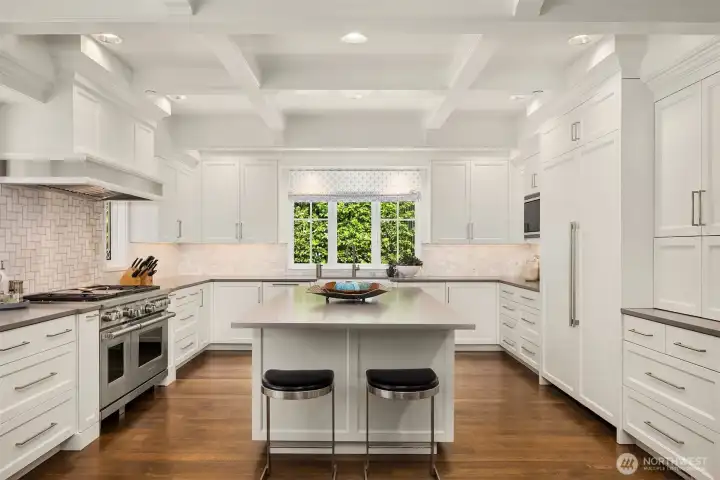 A culinary masterpiece, remodeled in 2020 chef's kitchen features top-tier professional appliances, including a premium Wolf range with double ovens, a Sub-Zero refrigerator and freezer, and a Sub-Zero wine fridge alongside two beverage refrigerators. Designed for effortless entertaining and maximum efficiency, the space also boasts dual dishwasher options: two Fisher & Paykel dishwasher drawers plus an additional full-sized Miele dishwasher. A culinary masterpiece, remodeled in 2020 chef's kitchen features top-tier professional appliances, including a premium Wolf range with double ovens, a Sub-Zero refrigerator and freezer, and a Sub-Zero wine fridge alongside two beverage refrigerators. Designed for effortless entertaining and maximum efficiency, the space also boasts dual dishwasher options: two Fisher & Paykel dishwasher drawers plus an additional full-sized Miele dishwasher.
