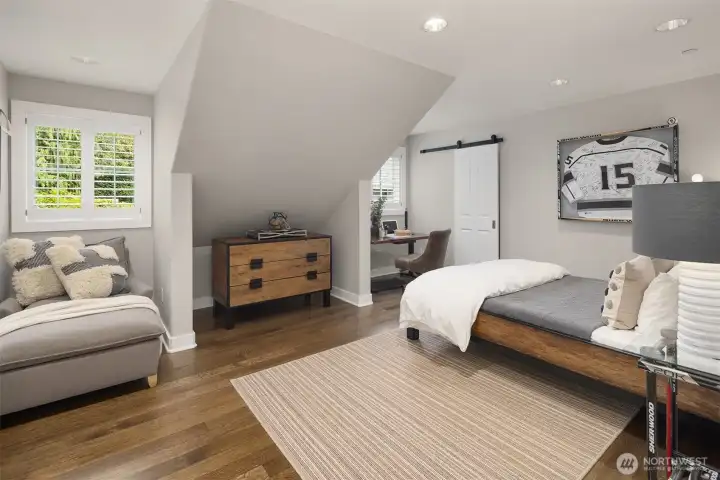 One of three upstairs bedrooms, featuring an exceptional layout with two separate walk-in closets. Includes its own private 3/4 bathroom, creating a highly comfortable and self-contained suite. One of three upstairs bedrooms, featuring an exceptional layout with two separate walk-in closets. Includes its own private 3/4 bathroom, creating a highly comfortable and self-contained suite.