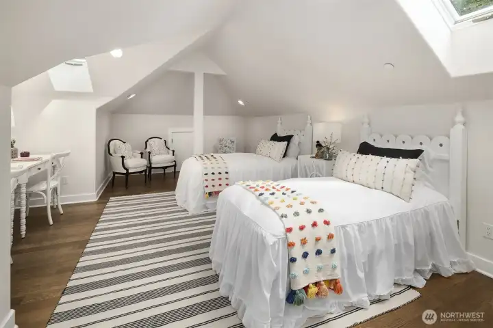 Charming third upstairs bedroom featuring a bright architectural skylight that fills the space with beautiful natural light. Offers a spacious, versatile layout perfect for a cozy guest room or private retreat. Full bathroom is steps away with both a soaking tub and a walk in shower. Charming third upstairs bedroom featuring a bright architectural skylight that fills the space with beautiful natural light. Offers a spacious, versatile layout perfect for a cozy guest room or private retreat. Full bathroom is steps away with both a soaking tub and a walk in shower.