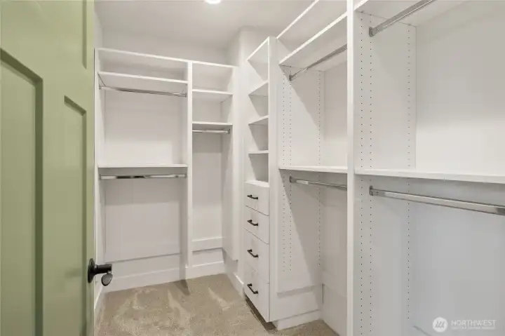 Primary walk-in closet Primary walk-in closet
