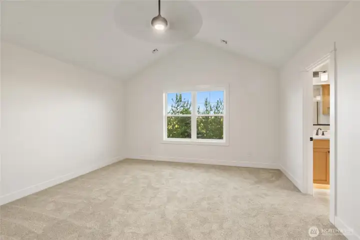 Primary Bedroom with vaulted ceiling Primary Bedroom with vaulted ceiling
