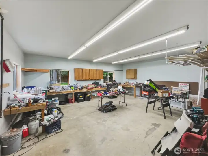 LARGE workshop, entered through double doors in the 2 car garage (not pictured). 220 voltage for tools, equipment. LARGE workshop, entered through double doors in the 2 car garage (not pictured). 220 voltage for tools, equipment.