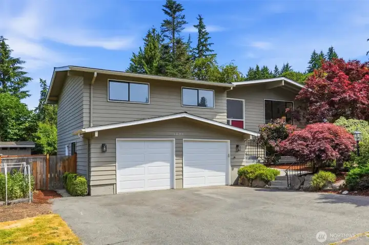 Fresh paint and new garage doors enhance the home's street appeal.