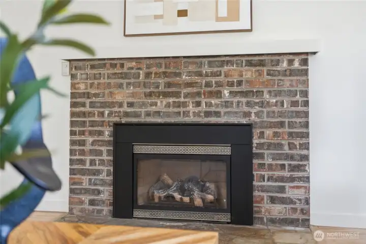 The gas fireplace anchors the living room.