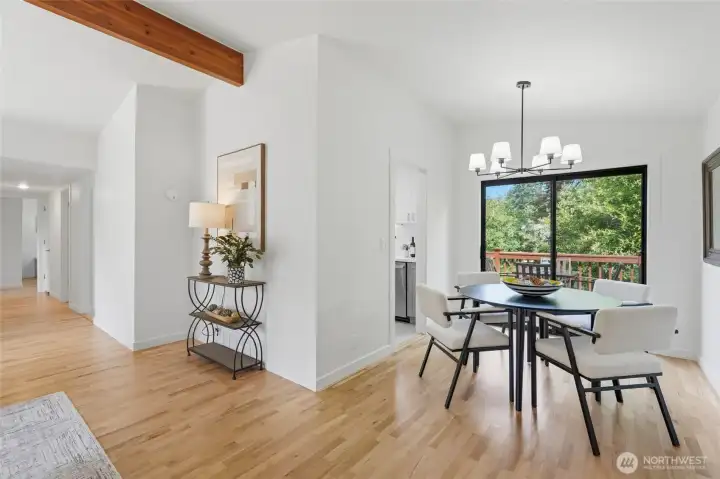 Looking toward the dining area and the hallway to the bedrooms on the left.