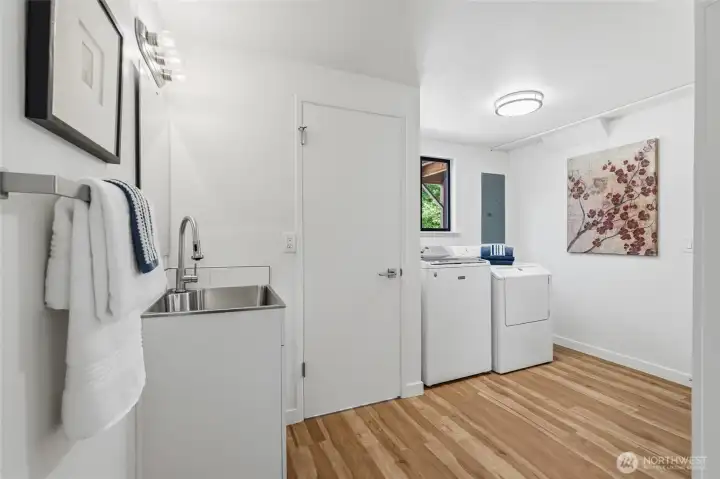 The lower level includes a utility room with a half bath.