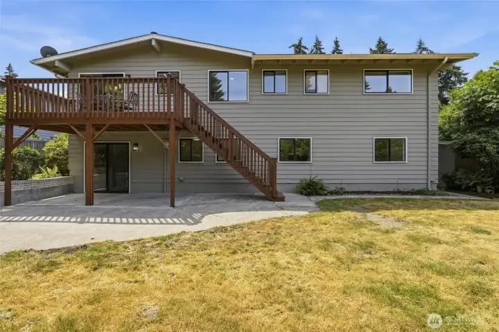 View of the house from the level fully-fenced back yard.