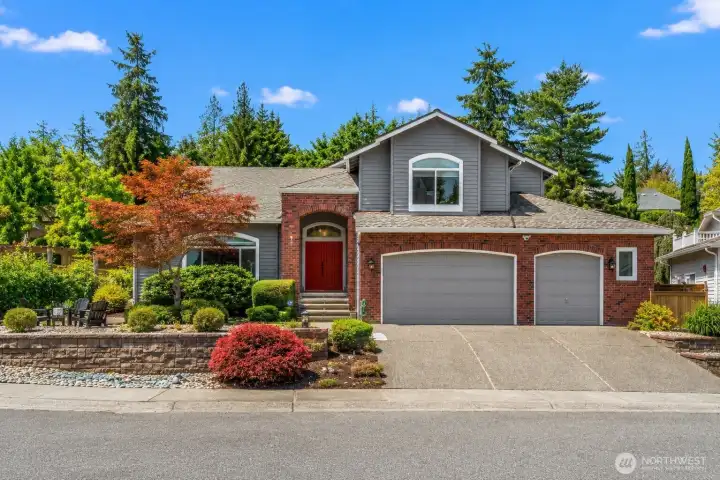 Modern elegance in Issaquah offering beautiful lush landscaping and a $300K+ remodel
