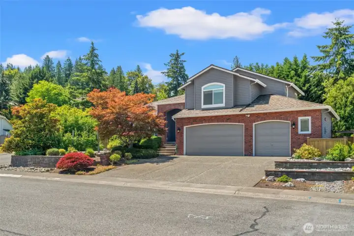 This large corner lot offers privacy and an 880 SF 3 car garage