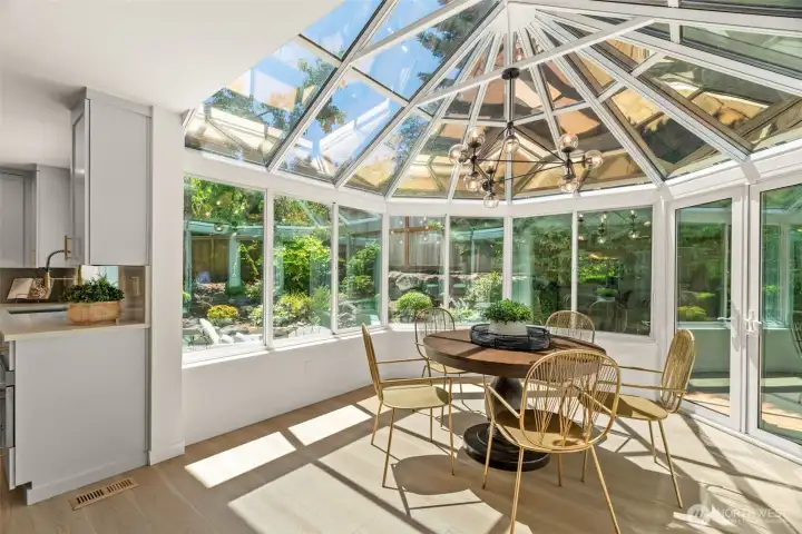 An amazing sunlit eating nook perfect for relaxation and lush views!