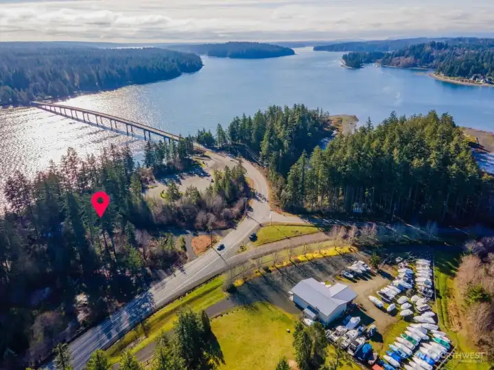 The home is located right before crossing the Harstine Bridge, just about 3 miles from Hwy 3. Two 'doors' down is a free public boat launch.