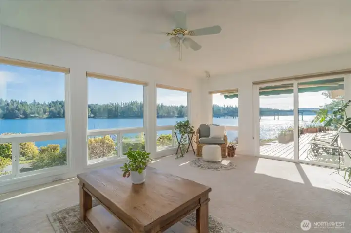The 2nd primary suite has a lovely sitting room attached. It's perfect for lounging or your art easel. It has it's own direct access to the deck.