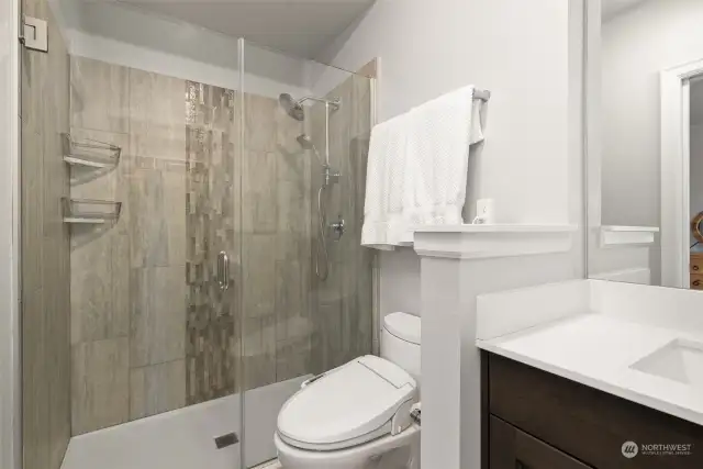 Primary bathroom features a large, walk-in shower