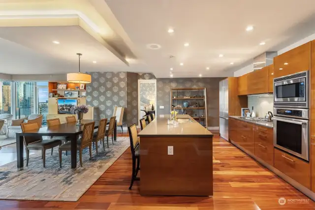 Exquisite fittings for the chef, anchored by a spacious island with bar seating, Pedini cabinetry, top level appliances and beautiful slab stone countertops.